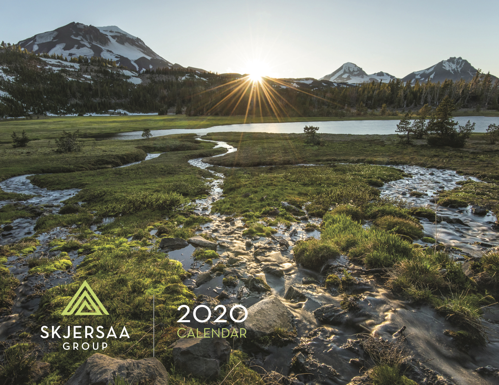 Cover of the 2020 Skjersaa Group annual print calendar featuring landscape photo of the Three Sisters peaks